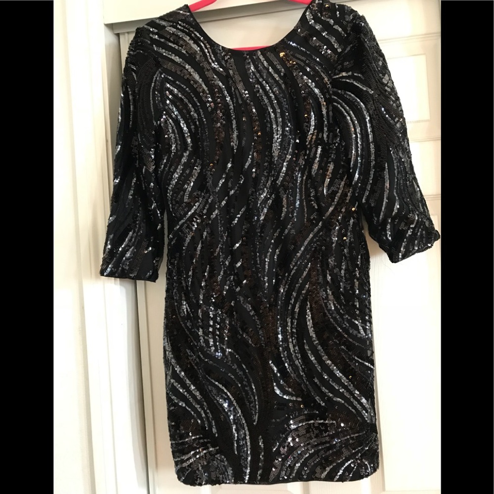 Woman’s black sequins dress